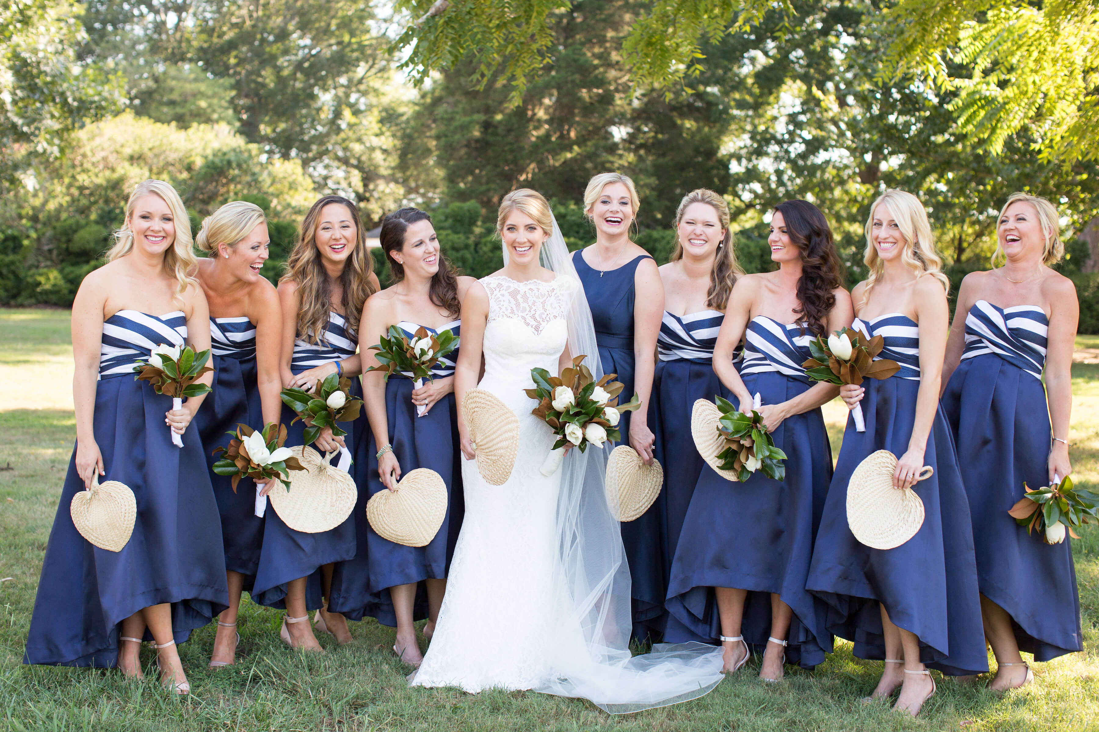 bride with navy and white striped bridesmaids dresses
