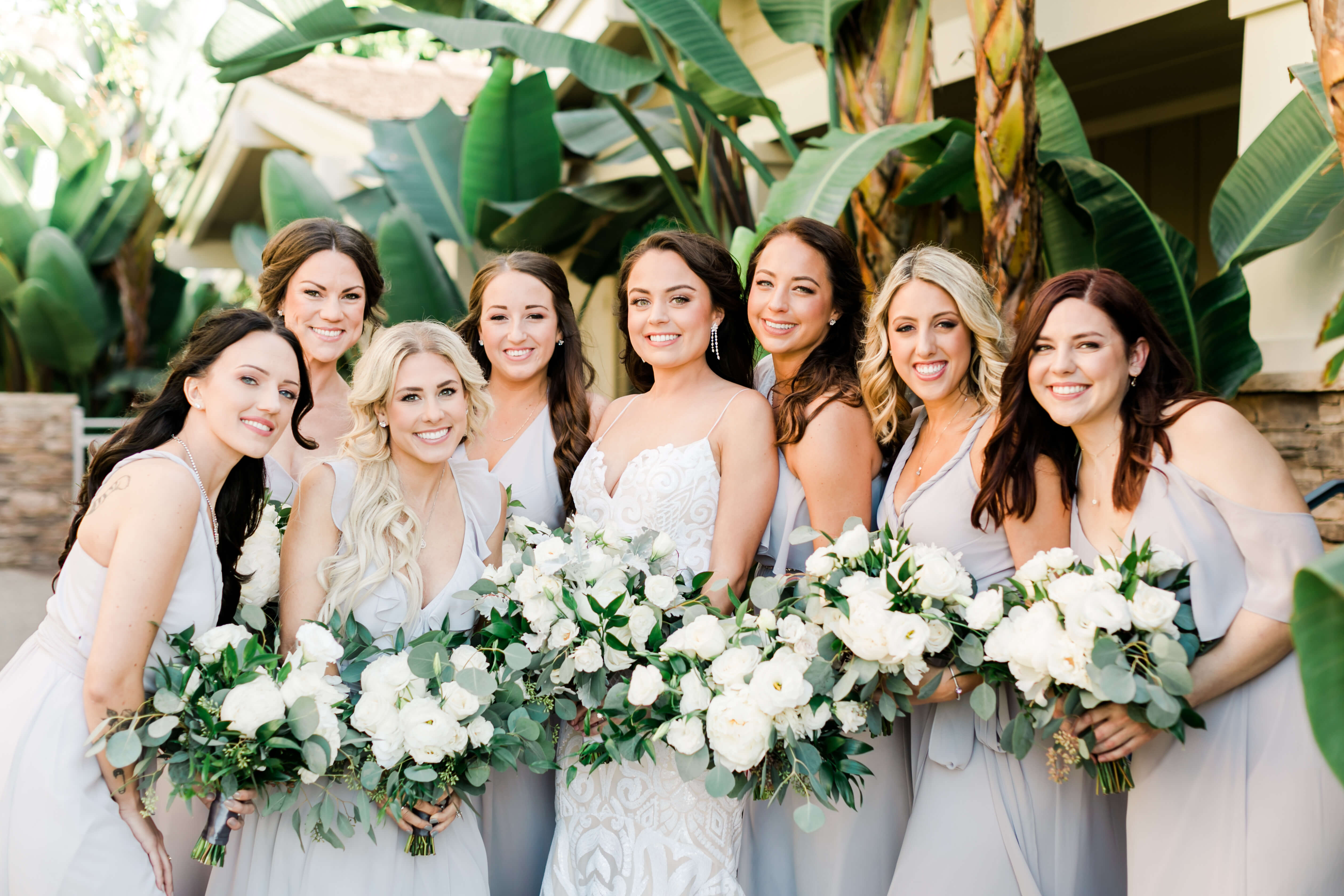 bridesmaids in soft gray with eucalyptus