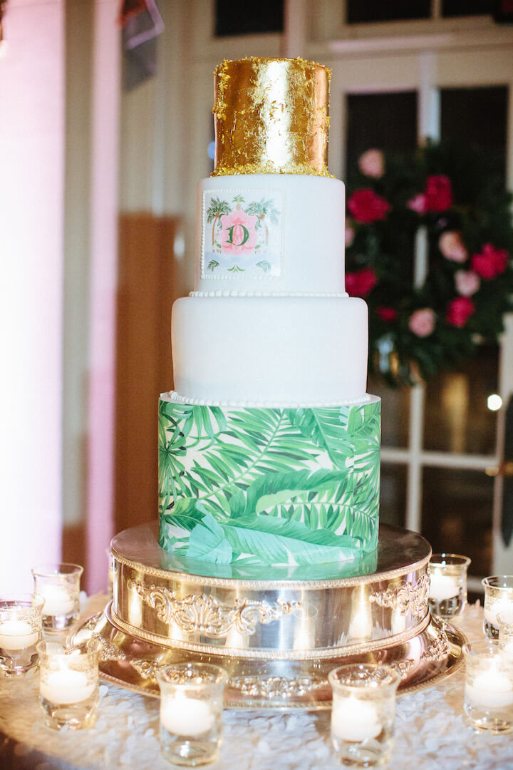 Palm leaf and gold wedding cake with monogram