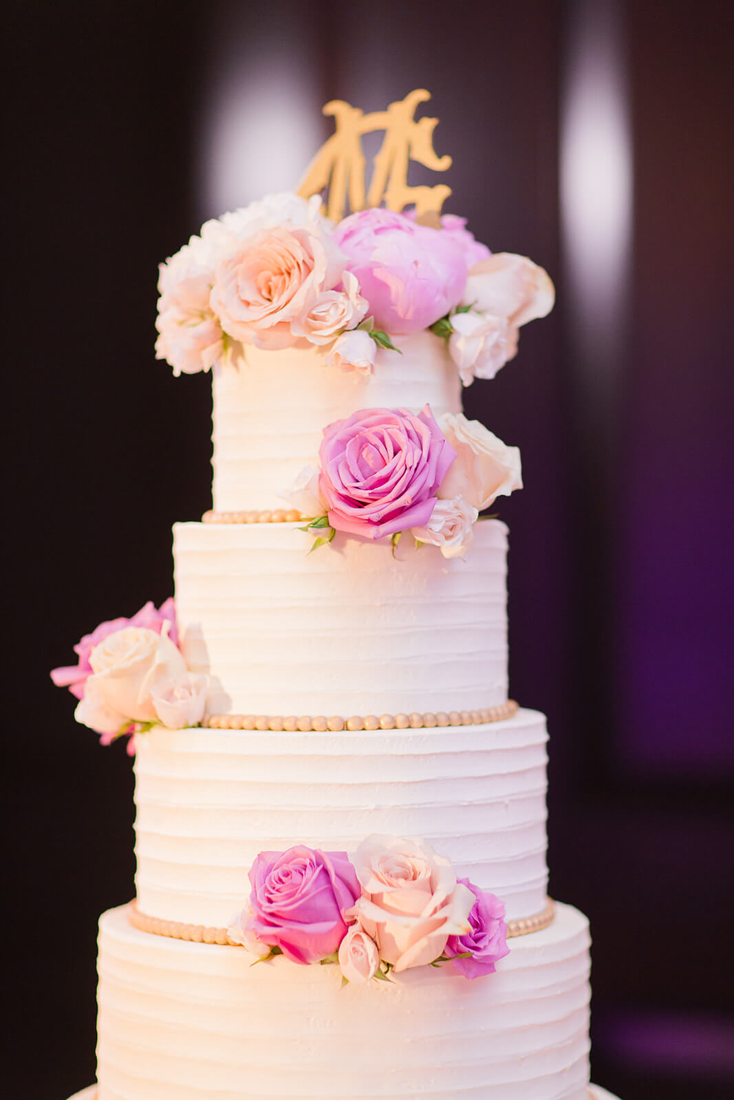 Monogrammed white wedding cake